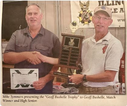 Geoff Bushelle getting award